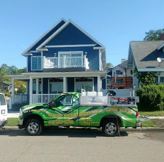 high performance services truck on a exterior house washing job