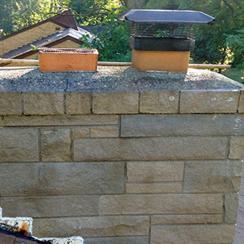 concrete cleaning on chimney concrete blocks 